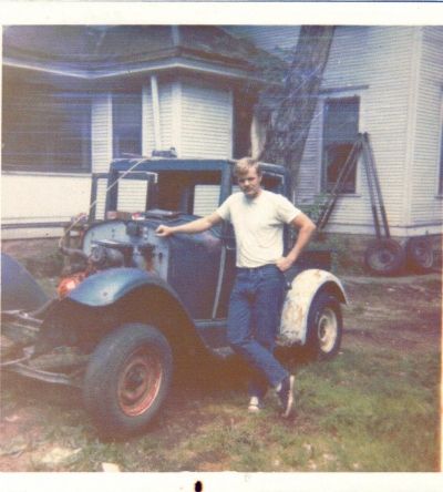 Owen Martin with the Essex Before Restoration. This was in his Butch Cassidy look-alike days. When he acquired the vintage car, it was in rough shape and needed some TLC.