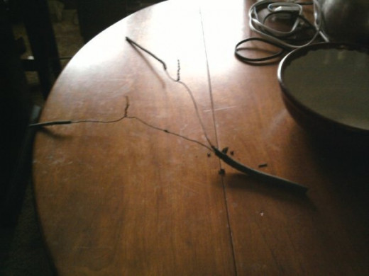 How NOT to splice electrical wires. Original knob and tube on left, romex on right, with open splices in the middle.