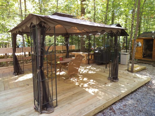 This is the part of the deck where we eat in the summer. The gazebo has screen panels that can be pulled across to form a barrier for mosquitoes. Mostly we don't use the screen. 