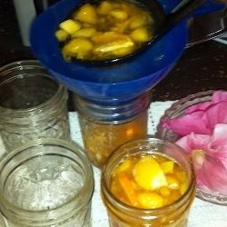 Use a wide-mouth funnel to fill the jars