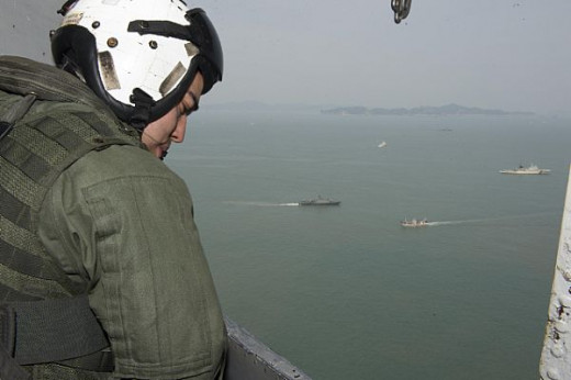 USMC Cpl Rogers in CH-53E (US Navy Photo/Christian Senyk)