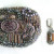 This brooch has purple vintage glass opal cabochons and contemporary glass beads and pearls embroidered on Ultrasuede. The earrings are bead weaving. This brooch has purple vintage glass opal cabochons and contemporary glass beads and pearls embroidered on Ultrasuede. The earrings are bead weaving.