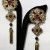 Fabulous shoulder duster earrings commissioned by a client for a fancy Washington, DC event. Garnets, pearls & rhinestones embroidered on filigrees. Fabulous shoulder duster earrings commissioned by a client for a fancy Washington, DC event. Garnets, pearls & rhinestones embroidered on filigrees.