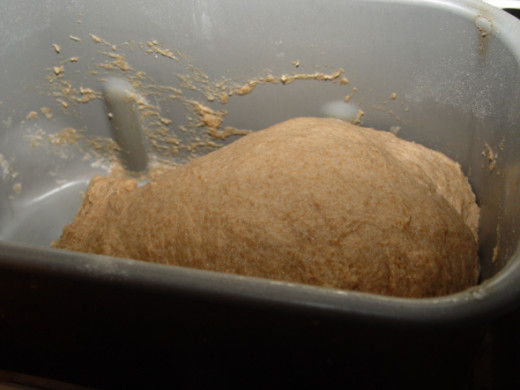 A kneaded dough ball, elastic and slightly sticky.