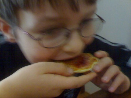 Ryan enjoying pikelets