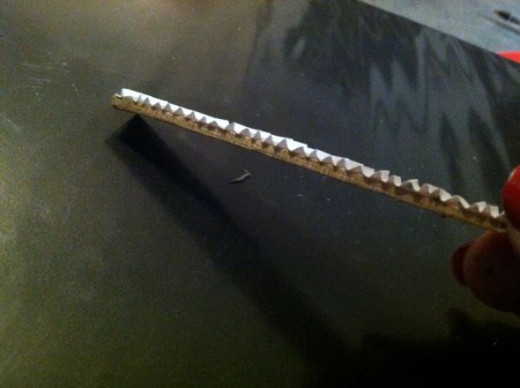 The folded paper is attached to the step frame
