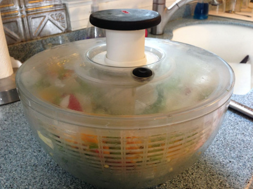 Here is the Oxo Salad Spinner ready to be spun. A few presses of that top black button and water is shed.