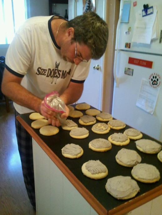 Eric decorates sugar cookies