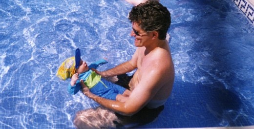 Baby Aged 4 months wearing UV protected swimwear