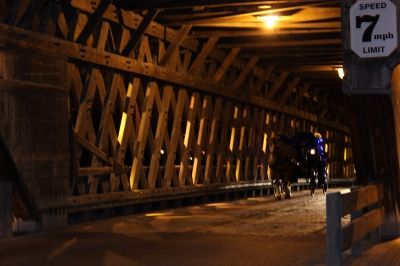 Horse-Drawn Carriage Coming Down Covered Bridge