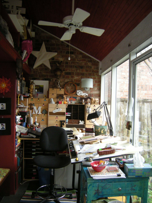 My studio.  Spiffy 11" x 17" boxes are stored on shelves under that layout table to my left as I draw - and I still have knee space too.