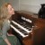 Kristen Lawrence is a classically trained organist who writes Halloween music. Her little black kitty Molly often joins her for practice time. Kristen Lawrence is a classically trained organist who writes Halloween music. Her little black kitty Molly often joins her for practice time.