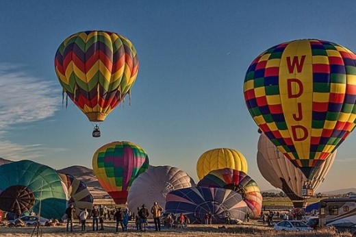 Ballons being inflated and rising into the morning sky