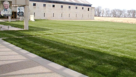 Feel free to curse at the sight of a sea of grass where the library parking *should* be. Pretend Bill (Wm Allen) White and Mamie Williams aren't really chuckling at your plight.