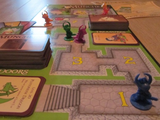 Munchkin Deluxe game board and game pieces