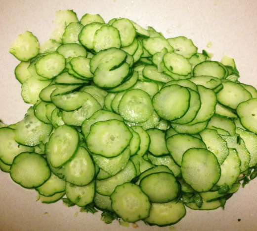 Slice the cucumbers very thin. Use a vegetable slicer if you can. Add the salt.