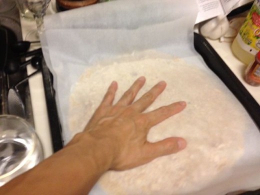 Pressing the nuts into the dough.