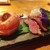 Our main course of duck with another intricate side dish inside the porcelain duck.