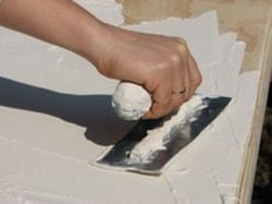 laying plaster on wood support