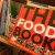 The Food Book on my bookshelf, bright red sticking out like a sore thumb.