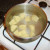 Potatoes are peeled, chopped and added to cold, salted water