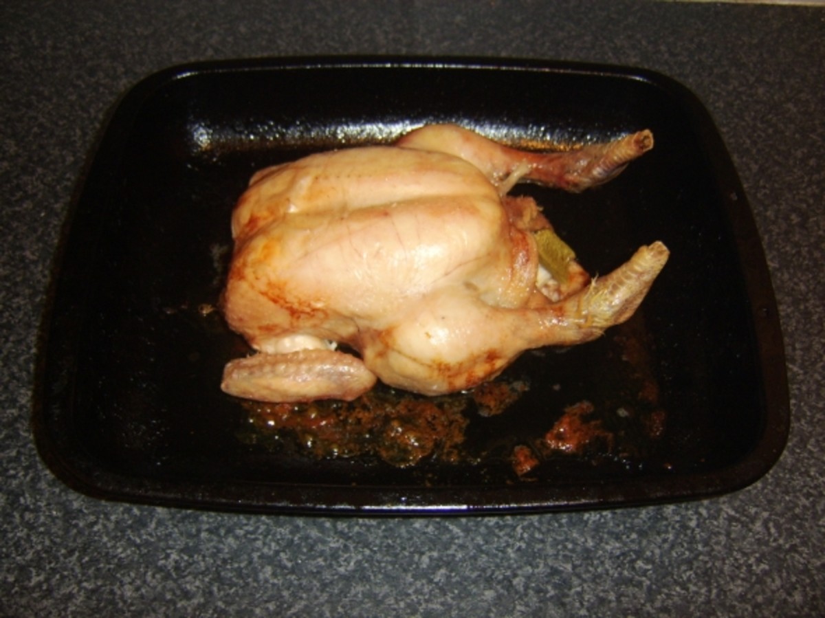 Roast chicken is cooked and ready to be rested