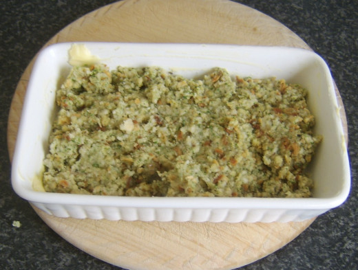 Stuffing is added to butter greased ovenproof dish