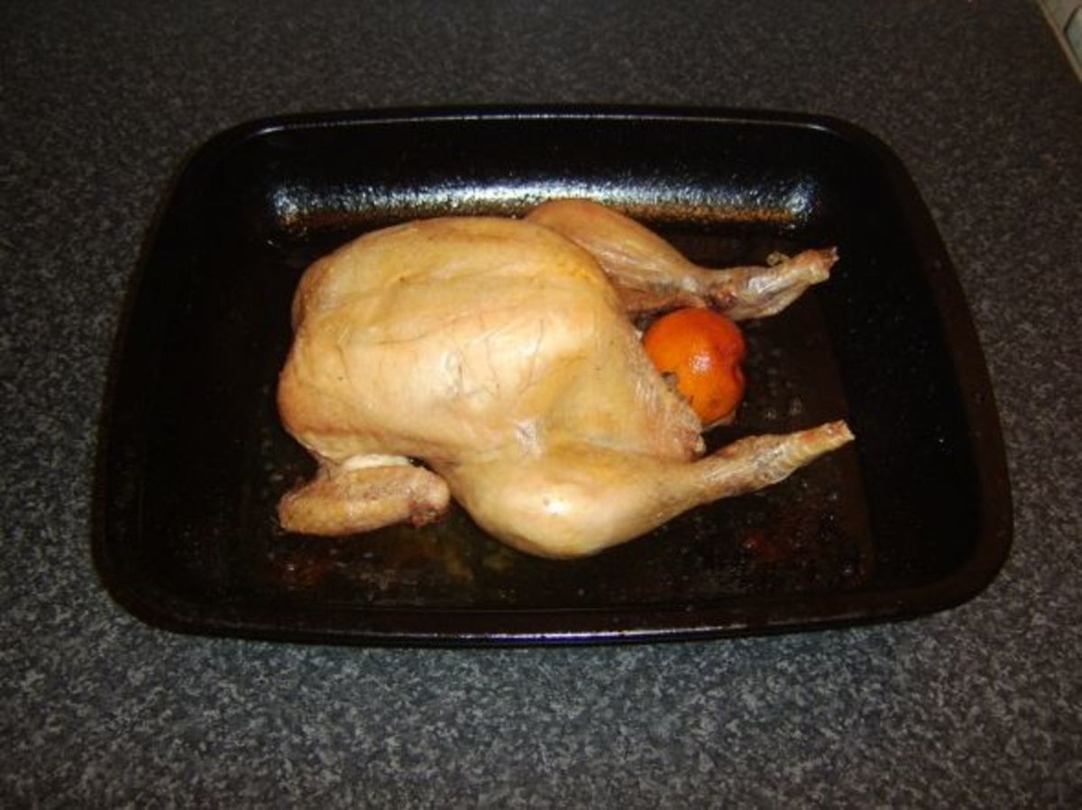 Citrus fruit and thyme roast chicken removed from the oven