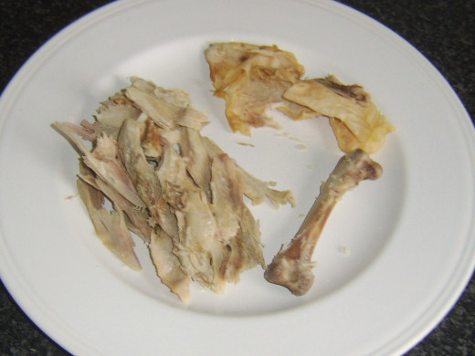 Leftover turkey thigh meat separated from skin and bone