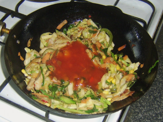 Sweet and sour sauce is added to turkey and vegetables