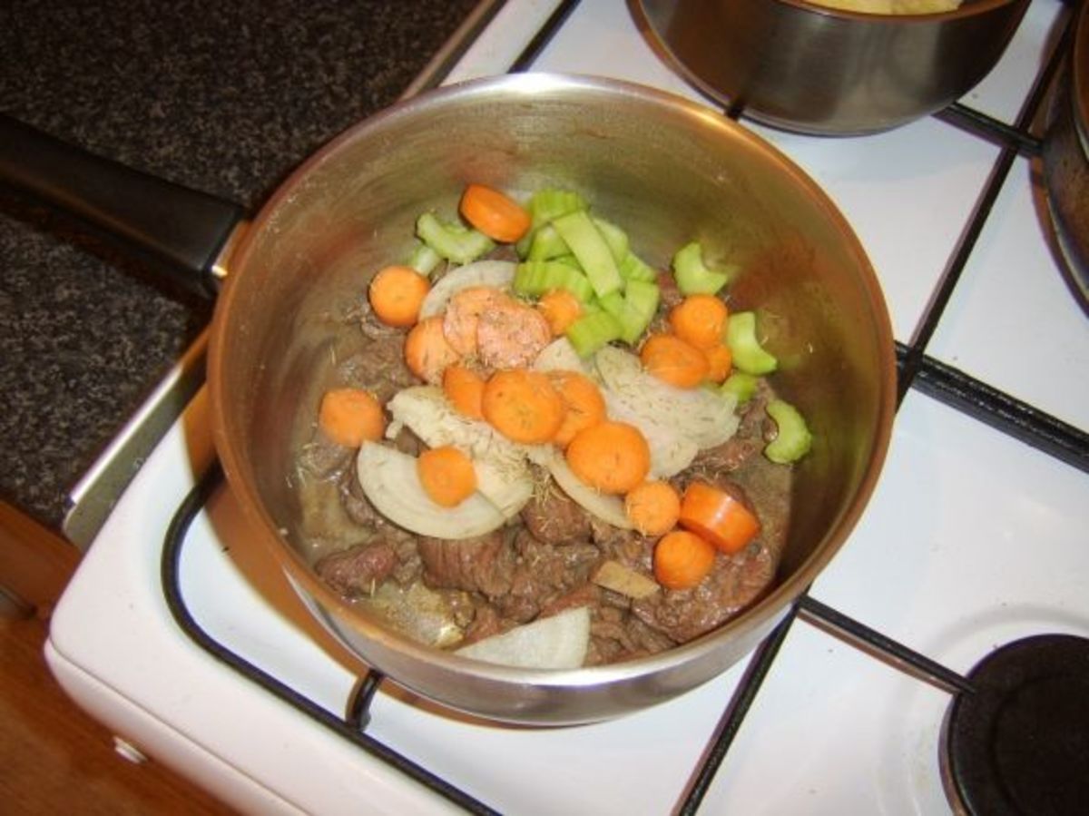 Vegetables and seasonings are added to the browned venison