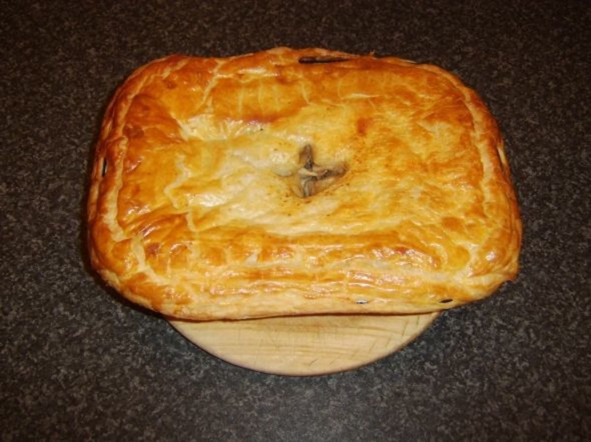 Venison and guinea fowl game pie removed from the oven