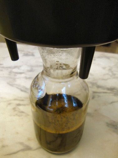 Place the carafe under the large bowl, remove the plug and your coffee concentrate drips down. We allow at least an hour to drain. Then we reuse the same coffee with half as much water (3 cups) to make our coffee budget stretch even further.