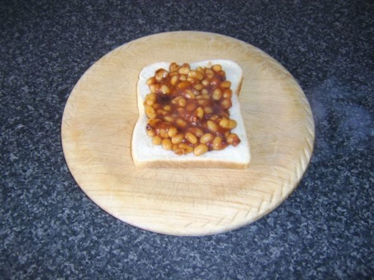 Baked beans and pickle is spread on bread