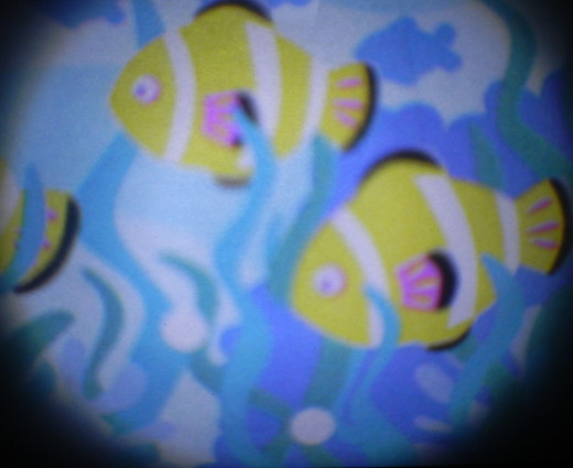 cute little fish, floating across the wall! Part of the sea projection lens