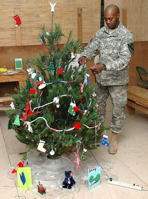 Soldier decorating Christmas Tree