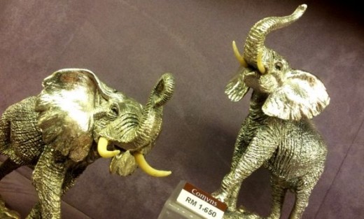 A pair of sterling silver elephants from the Comyns collection.