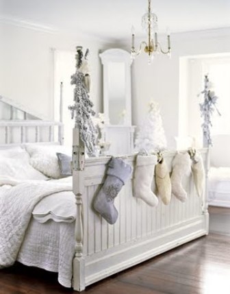White ChristmasI love when people carry holiday decorating into the bedrooms. Here guests wake up to white trees, garland and white linen stockings draped along the footboard.By willowdecor.blogspot.com