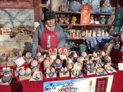 Some of the crafts that are for sale in the courtyards between the temple buildings are centuries old, like this one.  The artisans make painted packed clay figurines for sale for each of the different years of the Chinese zodiac.  The biggest ones a