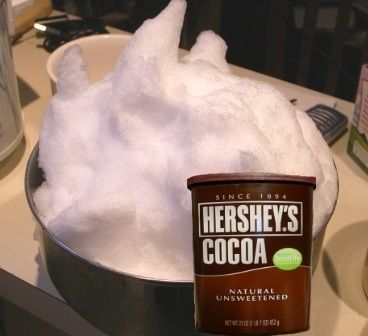 Snow with cocoa as part of ingredients for chocolate snow ice cream