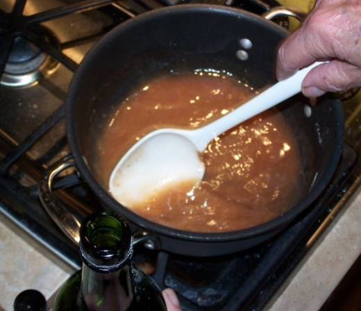 After removing the chicken from the hot olive oil, add the remaining flour mixture and stir well. It will be lumpy at first. After the flour is dissolved, begin adding the marsala, stirring continuously until all lumps are dissolved, and at least hal
