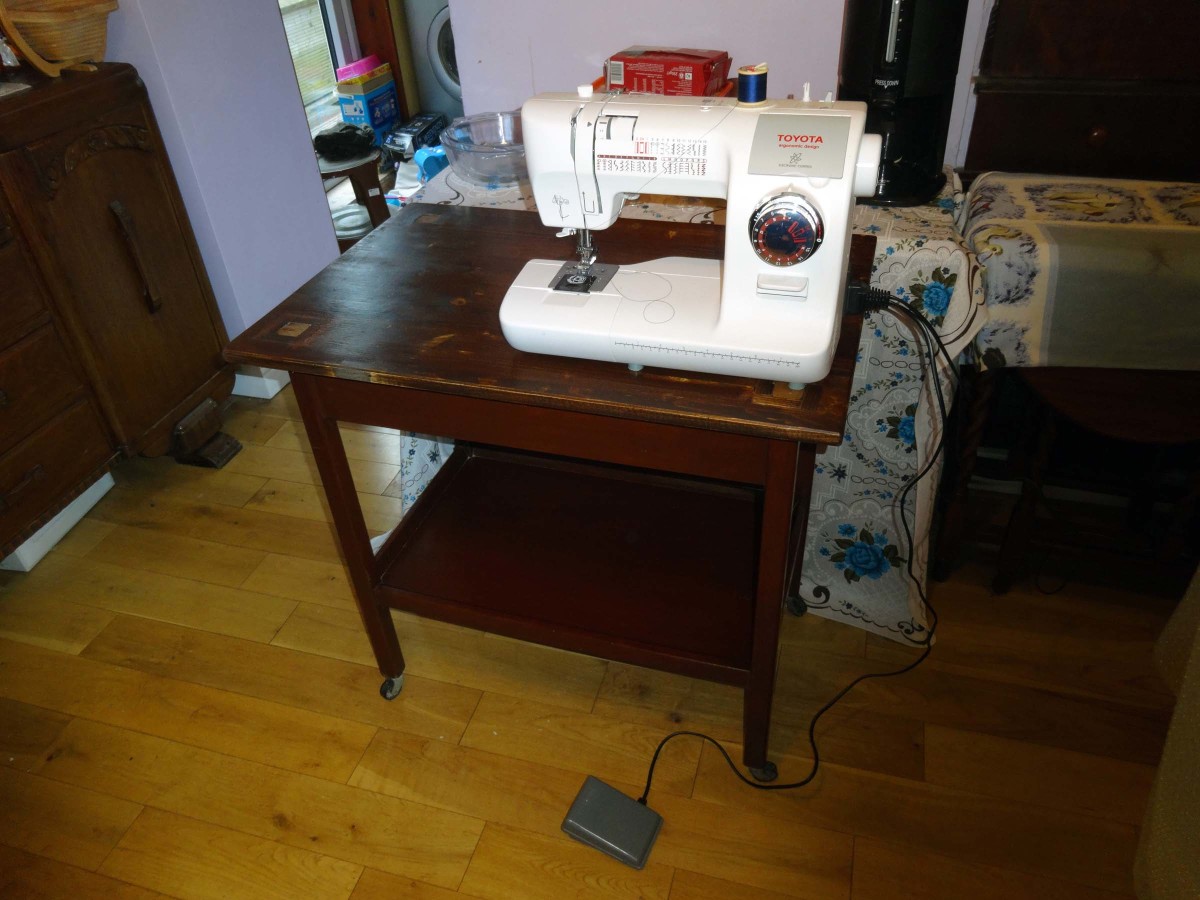 Sewing machine can be stored on bottom shelf, and when required placed on the table top