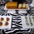 front featurs white marble loaf cake on a double pedestal rectangle platter, 2 square platters with dipped fortune cookies &amp; white chocolate truffles