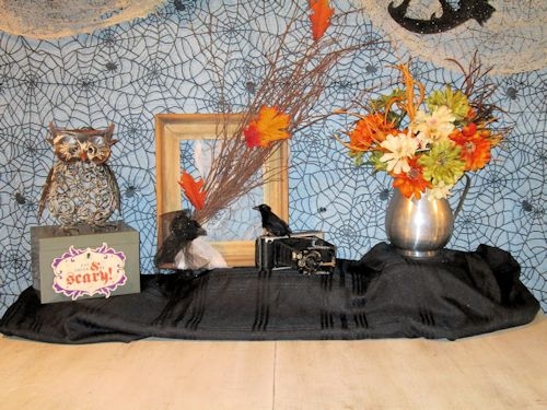 I added décor at the back: retro pitcher with flowers, a vintage box with a wire owl on top and an old camera. I perched a black raven on the camera.