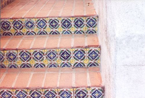 Mexican tile decorating the stairs. A person can go into Nogales and buy these from vendors who lay their wares out on the sidewalk.