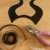 You need to punch 3 holes across the bottom - 1 in the middle and 1 on either side. These holes are used to attach the design to your band. You need to punch 3 holes across the bottom - 1 in the middle and 1 on either side. These holes are used to attach the design to your band.