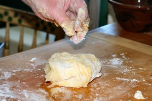 gooey dough on a woman's hands