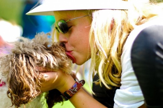 Pretty Woman Kissing a Dog
