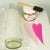 1. Using a piece of tissue paper the length and width of the bottle place it on the bottle and draw your heart designs. Using two shades of pink tissue cut out two hearts--one 1/2" larger than the other. Using decoupage paste glue the larger heart an