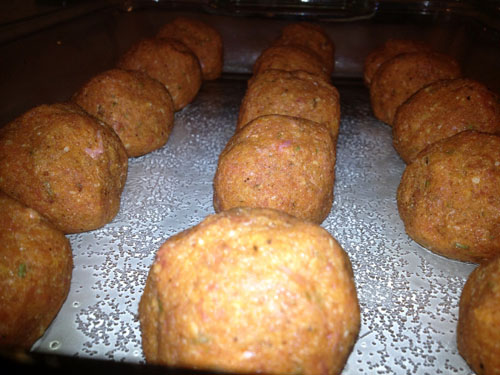 Roll the mixture into round, golf ball sized meatballs and place them on a cookie sheet or in a baking pan.